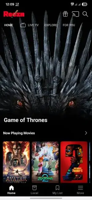 Reezn app home screen showing the featured movie banner and Now Playing Movies row